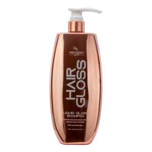 Rose gold shampoo bottle with white pump labeled 'Hair Chemist' on a white background