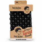 Twist Da Guys Compact Twist Brush for medium to long hair, shown in its original kraft paper packaging with a black textured hair twisting tool visible inside.