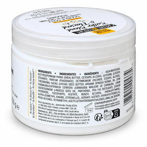 A white plastic jar of Creme de la Nature Butter & Blood Cream with its back label facing the camera, showing ingredients, barcode, and product details in English and French.