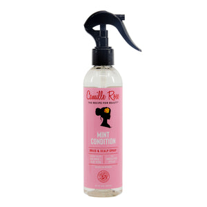 Pink bottle of Camille Rose Mint Condition hair and scalp spray on a white background