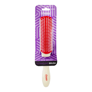 Annie brand 7-row detangling brush in red and white, packaged on a purple patterned backing card.