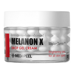 A clear cosmetic jar of MEDI-PEEL Melanon X Drop Gel Cream with a white lid, showing white drop gel capsules inside, on a solid white background.