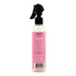 Bottle of hair care product with pink label on a white background
