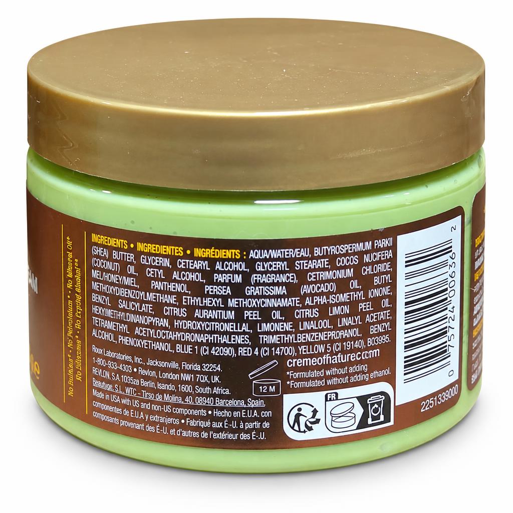 A close-up rear view of a round cosmetic jar with a tan lid and a light green body, showing the back label with ingredients, barcode, and usage icons on a white background.