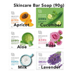 Collection of skincare product boxes with images and names of ingredients like apricot, cucumber, aloe vera, rose, milk, and lavender.