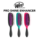 Three hairbrushes with black handles and colorful bristle heads on a white background, featuring the Wet Brush Pro logo.