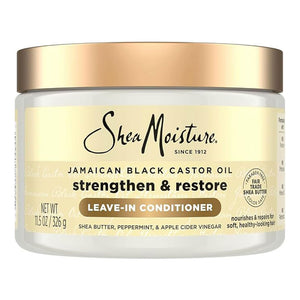 Shea Moisture Jamaican Black Castor Oil Leave-In Conditioner in a 11.5 oz white jar with a metallic gold lid and cream-colored label.