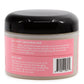 Back view of a jar of Aloe Renew Conditioning Mask with pink label and black lid.