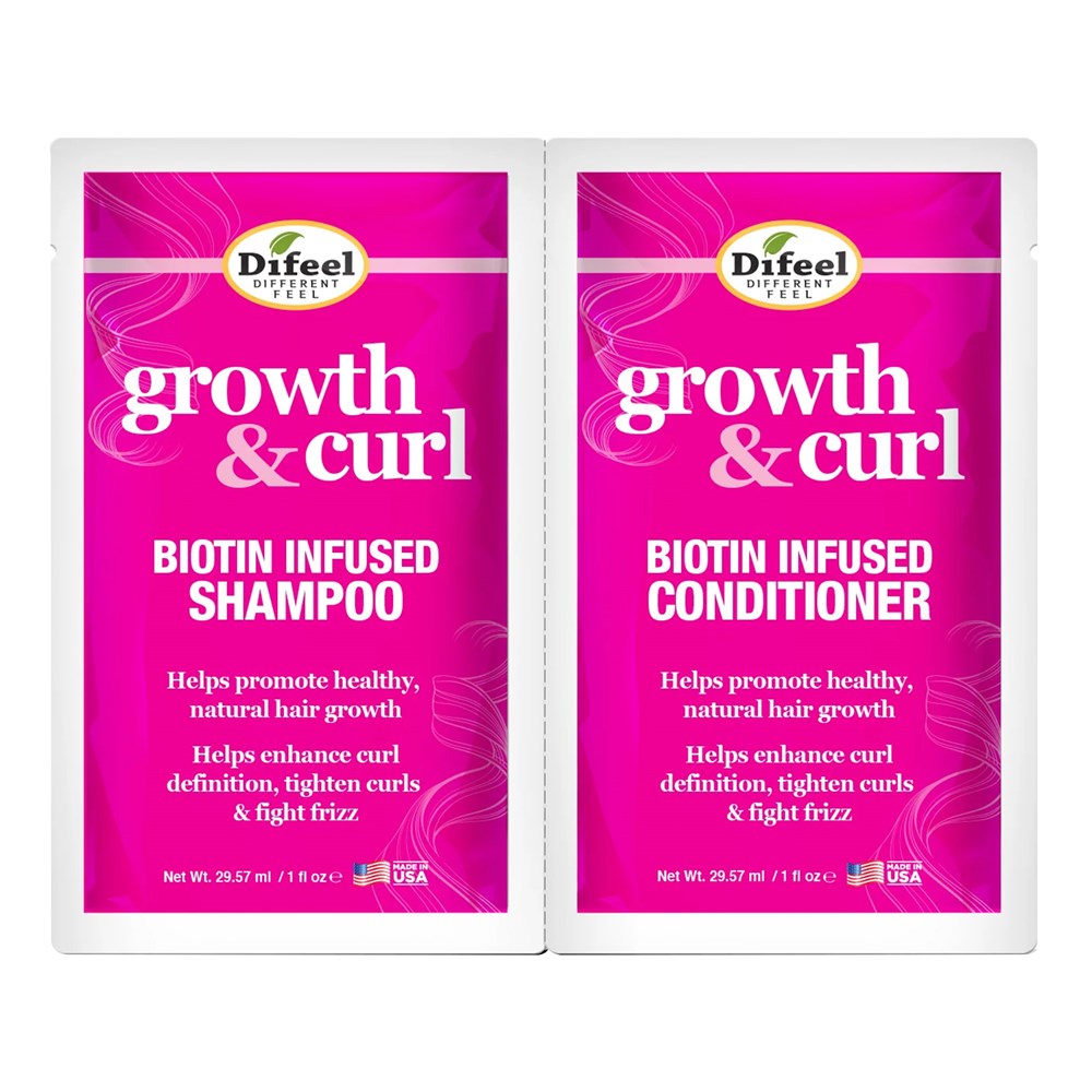 Two Difeel growth & curl biotin infused shampoo and conditioner packets on a white background.