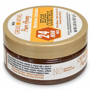A jar of Creme de Nature Pure Honey Edge Control hair product, featuring a gold lid with a white and orange label, and a clear jar showing the brown hair treatment inside.