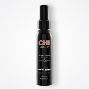Black bottle of CHI Luxury Black Seed Dry Oil Blend on a white background